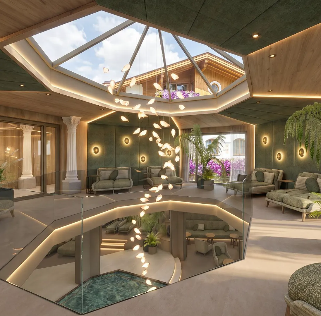 Luxuriöser Wellnessbereich mit Glasdach und eleganter Inneneinrichtung in einem alpinen Gebäude.
