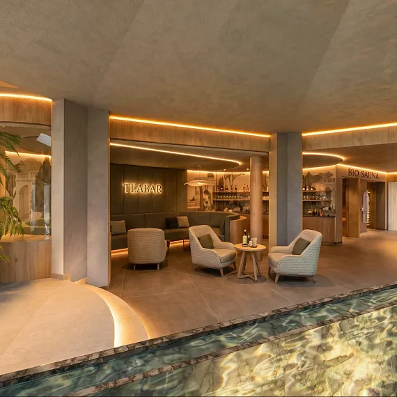 Eleganter Innenraum eines modernen Resorts mit Sitzbereich und Pool, sanfte Beleuchtung, stilvolle Dekoration.