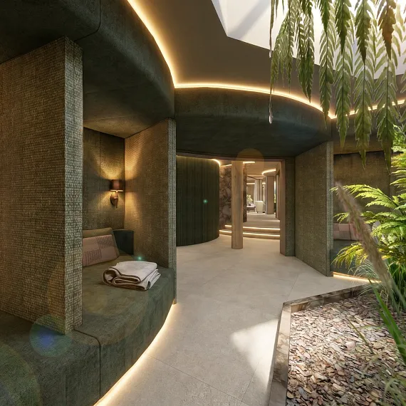 Modernes Spa-Innenraumdesign mit gemütlichen Sitznischen und Pflanzen, umgeben von stimmungsvoller Beleuchtung.